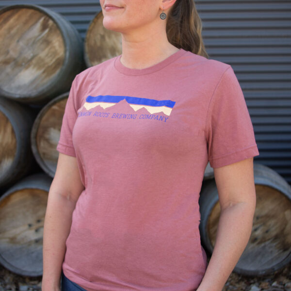 Mauve tee shirt with blue and tan mountain motif