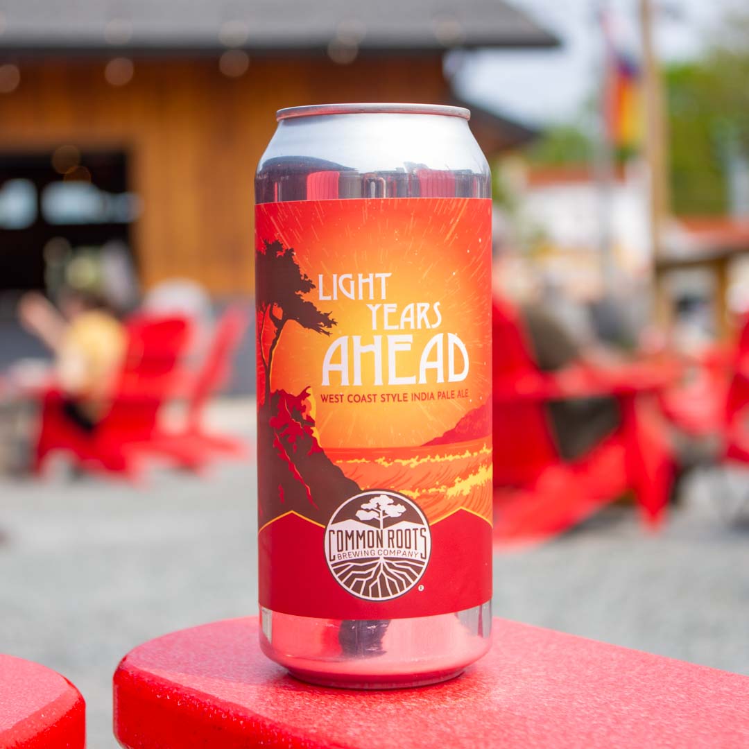 Can of Light Years Ahead with red Adirondack chairs in the background