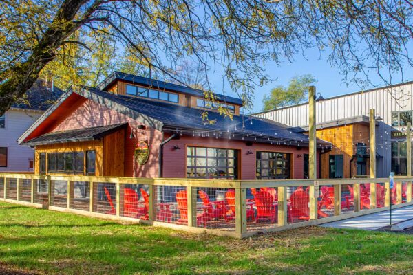 The Common Roogs café building with large outdoor seating area