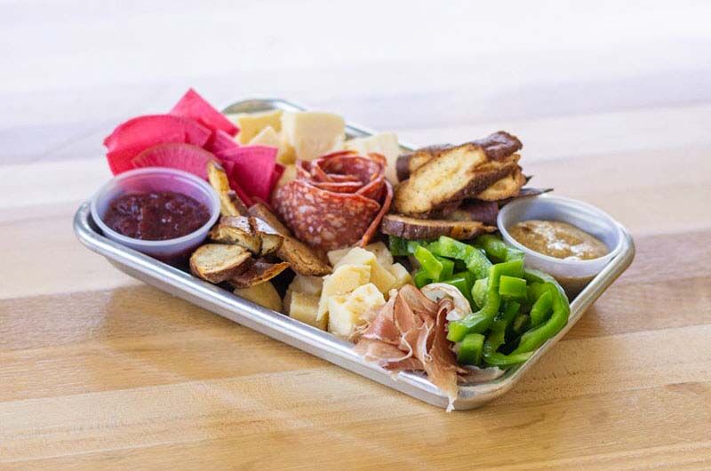 Plate with assorted cheeses and meats