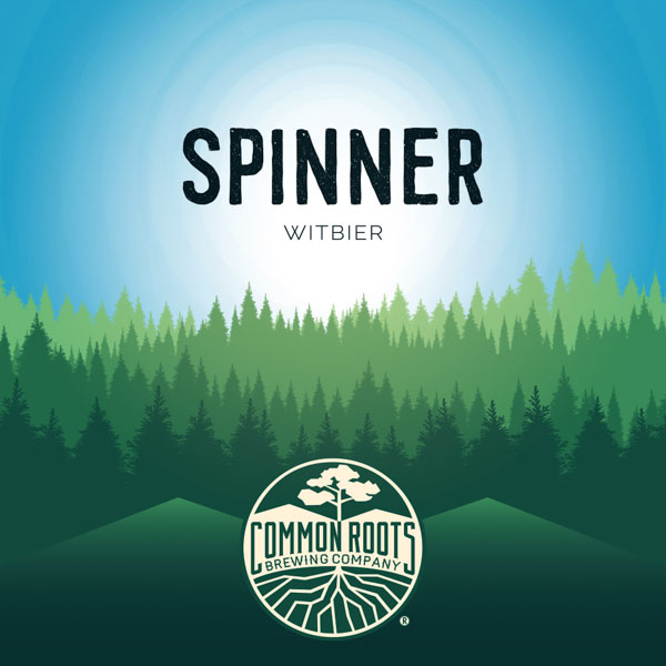 Spinner label, featuring a beautiful blue sky over green treetops.