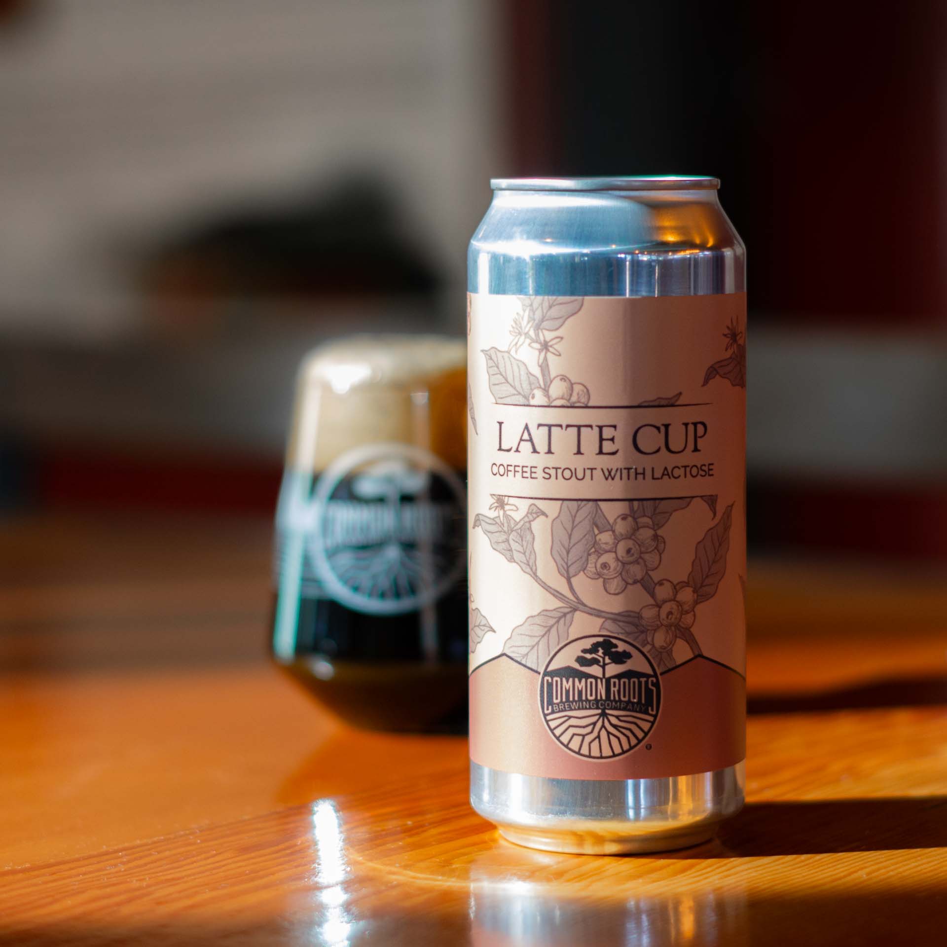Can of Latte Cup featuring a coffee plant illustration