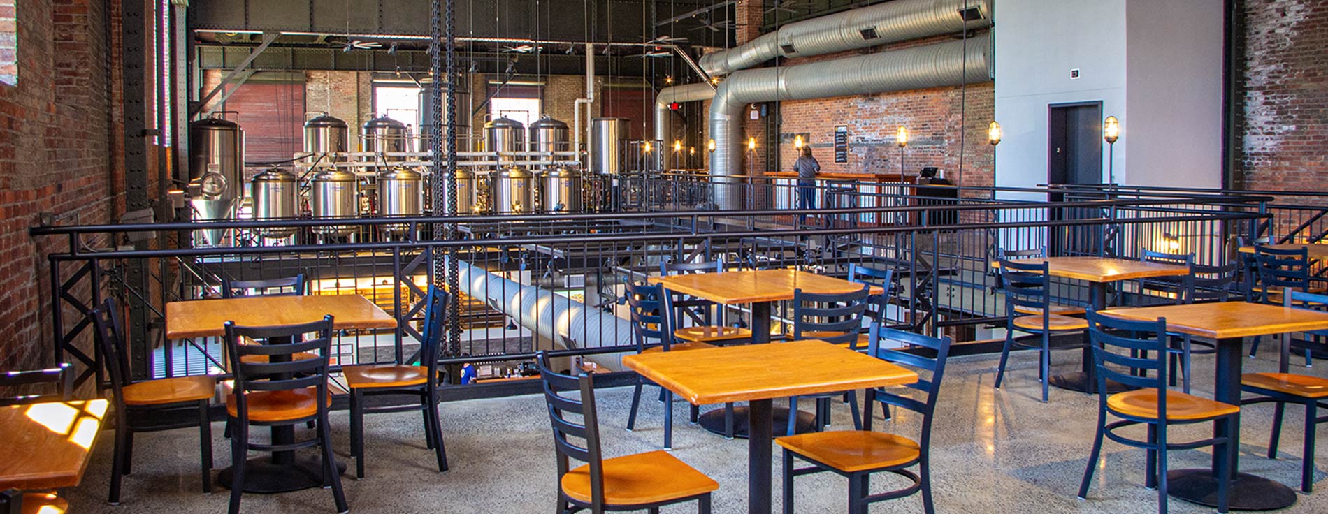 Balcony seating with brewery in the background