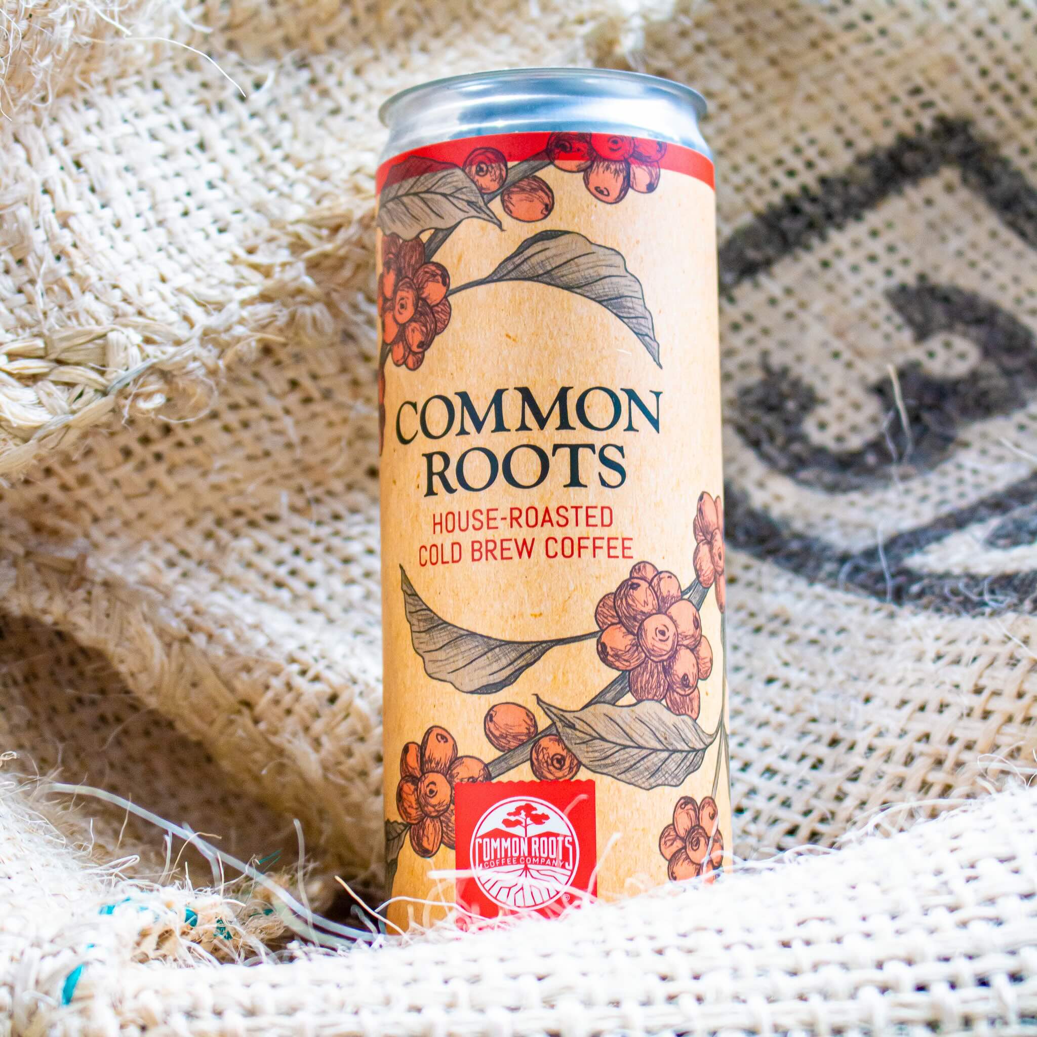 Common Roots cold brew can on green coffee bags