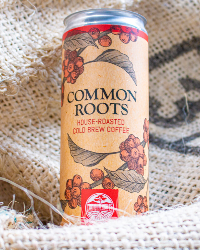 Cold brew can on green coffee bag