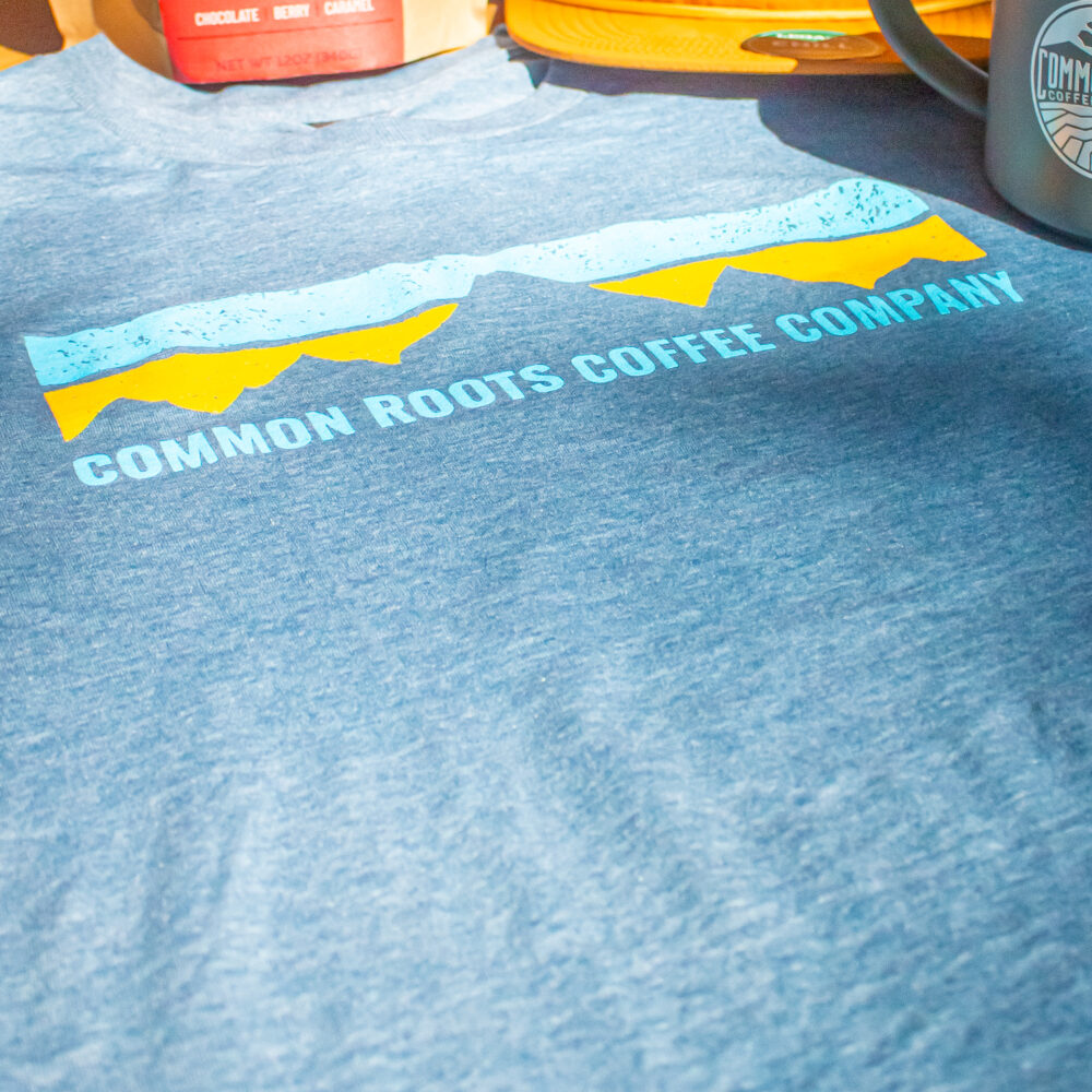 Close up of Common Roots Coffee Co. Tee logo