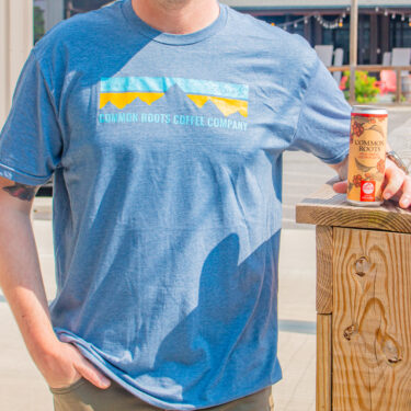 Common Roots Coffee Co. Tee shirt with cold brew can.