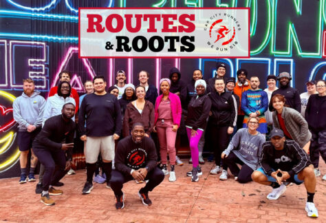 Runners Posing infront of a mural in Albany