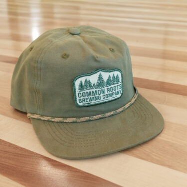 Green Patch Hat on Table